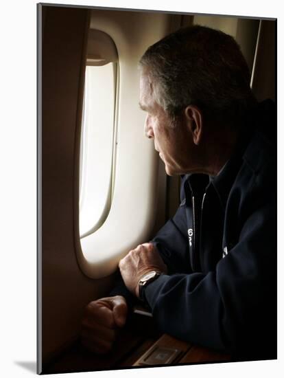 President Bush Looks out the Window of Air Force One Over New Orleans-null-Mounted Photographic Print
