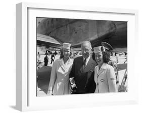 President Harry S. Truman Standing Near a Plane Flanked by Stewardesses-null-Framed Photographic Print