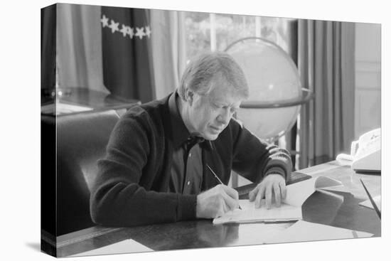 President Jimmy Carter Working at His Desk in the White House Oval Office, 1970s-null-Stretched Canvas