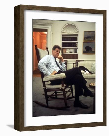 President John F. Kennedy Sitting in Rocking Chair in His White House Office-Paul Schutzer-Framed Photographic Print