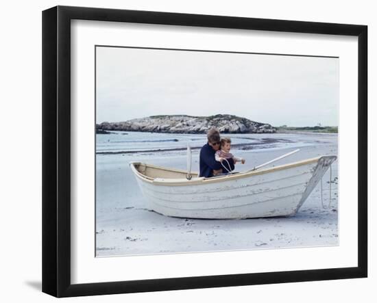 President John Kennedy and John Jr. Play in a Beached Rowboat at Newport, Rhode Island. 1962-null-Framed Photo