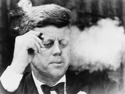 https://imgc.allpostersimages.com/img/posters/president-john-kennedy-smoking-a-cigar-at-a-democratic-fundraiser-oct-19-1963_u-L-PII5HR0.jpg?artPerspective=n