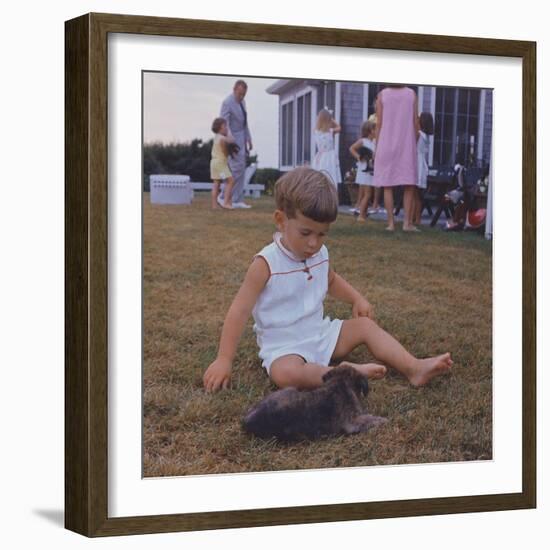 President Kennedy's Two Year Old Son, John Jr. Playing with a Puppy, Aug. 3, 1963-null-Framed Photo