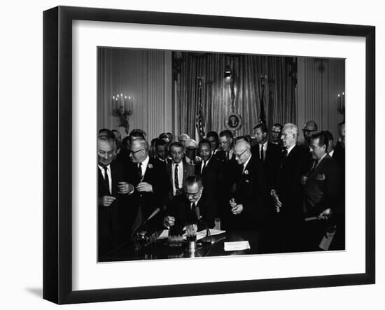 President Lyndon Johnson, Watched by Martin Luther King, Jr. Signing Civil Rights Act, July 2, 1964-null-Framed Photo