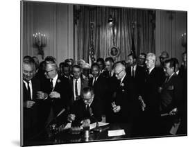 President Lyndon Johnson, Watched by Martin Luther King, Jr. Signing Civil Rights Act, July 2, 1964-null-Mounted Photo