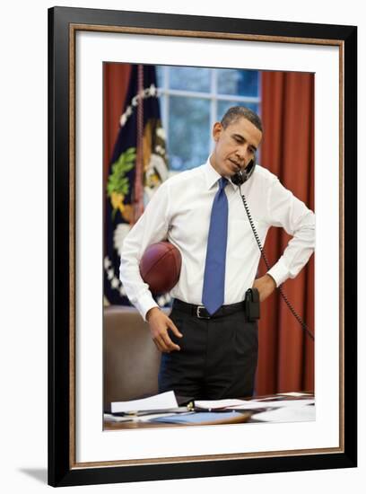 President Obama on the phone with House Speaker John Boehner:Oval Office, April 8, 2011-null-Framed Photo