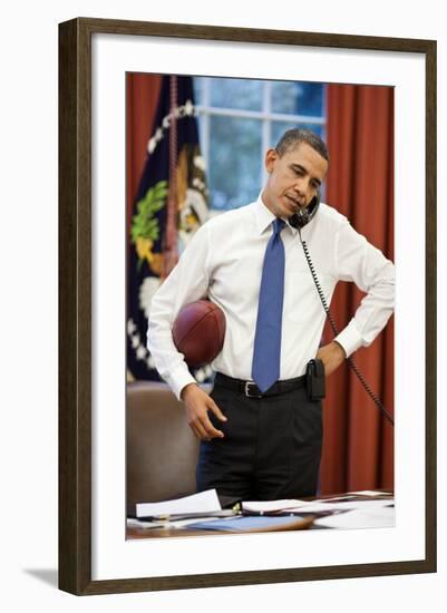 President Obama on the phone with House Speaker John Boehner:Oval Office, April 8, 2011-null-Framed Photo