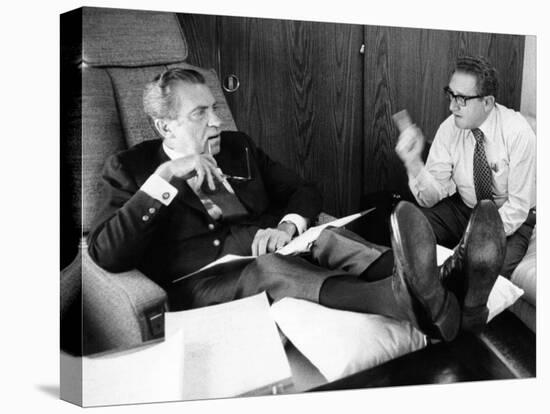 President Richard Nixon and Henry Kissinger Talking on Air Force One-null-Stretched Canvas