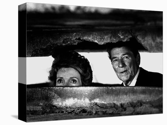 President Ronald Reagan and First Lady Nancy Reagan Peer out of a World War II Bunker-null-Stretched Canvas