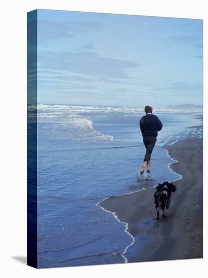 Presidential Candidate Bobby Kennedy and His Dog, Freckles, Running on an Oregon Beach-Bill Eppridge-Stretched Canvas