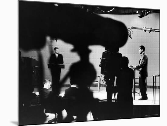 Presidential Candidates Senator John Kennedy and Richard Nixon Standing at Lecterns Debating-Paul Schutzer-Mounted Photographic Print