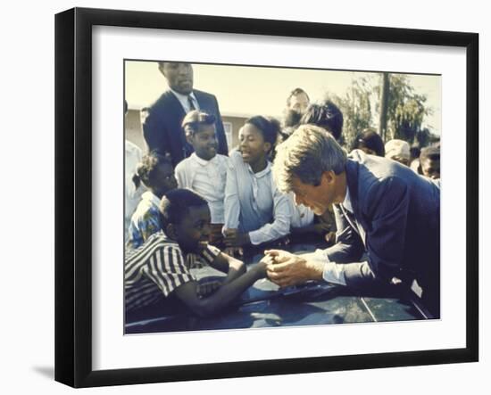 Presidential Contender Bobby Kennedy Stops During Campaigning to Shake Hands African American Boy-Bill Eppridge-Framed Photographic Print