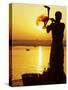 Priest Moves Lantern in Front of Sun During Morning Puja on Ganga Ma, Varanasi, India-Anthony Plummer-Stretched Canvas