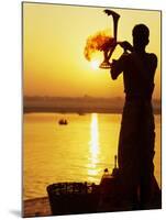 Priest Moves Lantern in Front of Sun During Morning Puja on Ganga Ma, Varanasi, India-Anthony Plummer-Mounted Photographic Print