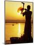 Priest Moves Lantern in Front of Sun During Morning Puja on Ganga Ma, Varanasi, India-Anthony Plummer-Mounted Photographic Print