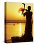 Priest Moves Lantern in Front of Sun During Morning Puja on Ganga Ma, Varanasi, India-Anthony Plummer-Stretched Canvas