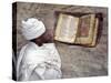 Priest of Ethiopian Orthodox Church Reads Old Bible at Rock-Hewn Church of Yohannes Maequddi-Nigel Pavitt-Stretched Canvas