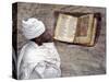 Priest of Ethiopian Orthodox Church Reads Old Bible at Rock-Hewn Church of Yohannes Maequddi-Nigel Pavitt-Stretched Canvas