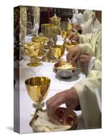 Priests' Hands Taking the Host During Mass in Easter Week-Eitan Simanor-Stretched Canvas