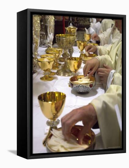 Priests' Hands Taking the Host During Mass in Easter Week-Eitan Simanor-Framed Stretched Canvas