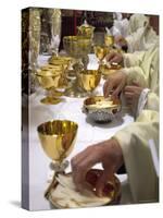 Priests' Hands Taking the Host During Mass in Easter Week-Eitan Simanor-Stretched Canvas