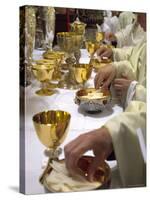 Priests' Hands Taking the Host During Mass in Easter Week-Eitan Simanor-Stretched Canvas