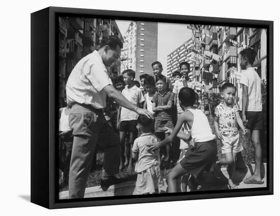 Prime Minister Kuan Yew Lee Talking to Children While Visiting a Housing Project-null-Framed Stretched Canvas