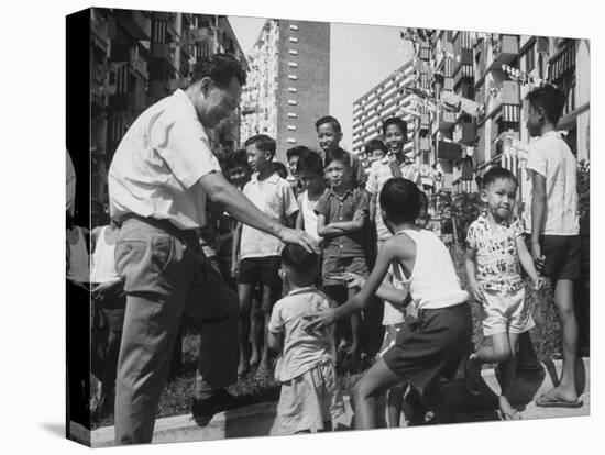Prime Minister Kuan Yew Lee Talking to Children While Visiting a Housing Project-null-Stretched Canvas