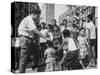 Prime Minister Kuan Yew Lee Talking to Children While Visiting a Housing Project-null-Stretched Canvas