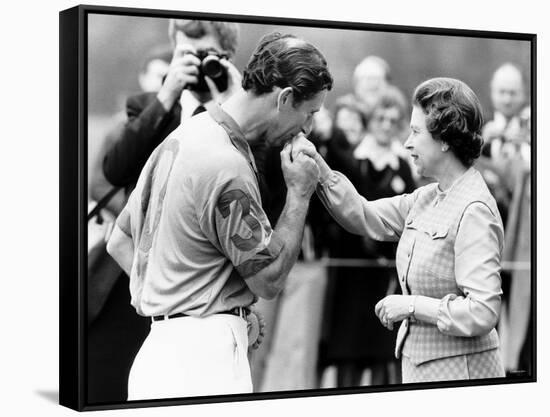 Prince Charles Kisses Hand of Mother Queen Elizabeth II After Presented with a Consolation Prize-null-Framed Stretched Canvas