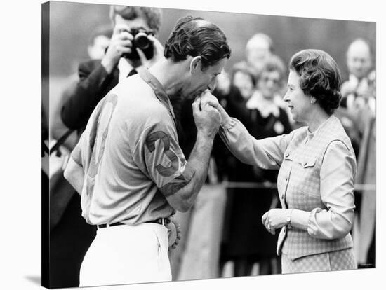 Prince Charles Kisses Hand of Mother Queen Elizabeth II After Presented with a Consolation Prize-null-Stretched Canvas