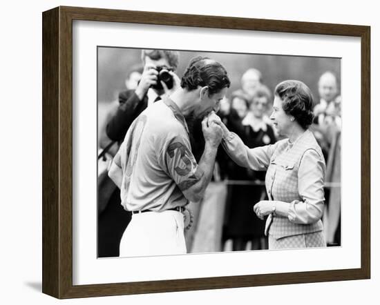 Prince Charles Kisses Hand of Mother Queen Elizabeth II After Presented with a Consolation Prize-null-Framed Photographic Print