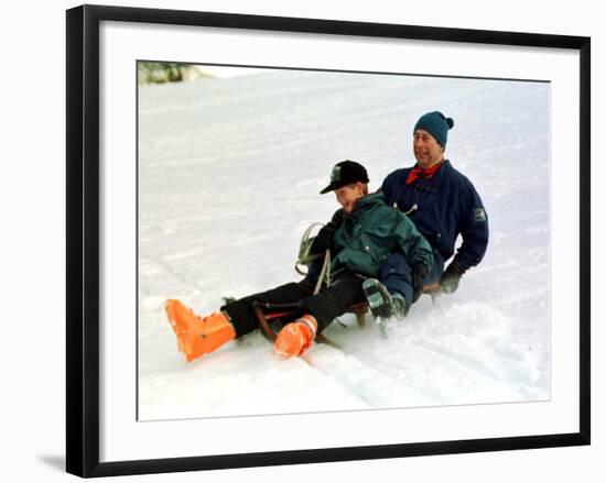 Prince Charles on a Sledge with Prince Harry While on Holiday in Klosters Switzerland January 1997-null-Framed Photographic Print