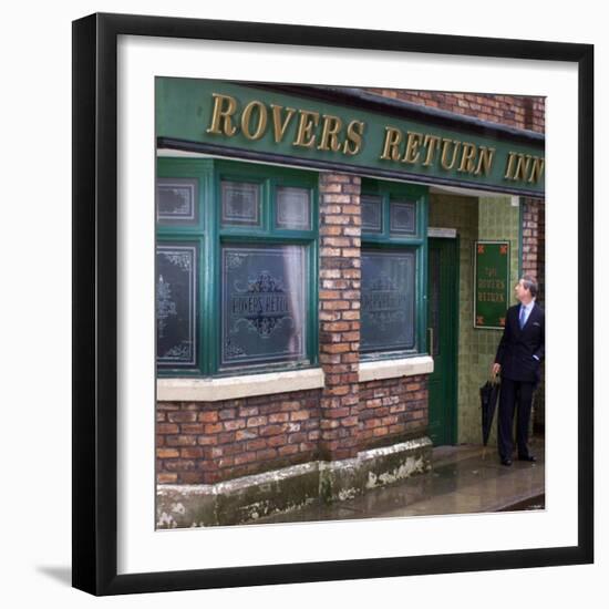 Prince Charles Shelters from the Rain on the Set of "The Soap Coronation Street"-null-Framed Photographic Print