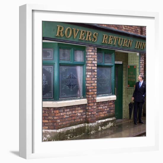 Prince Charles Shelters from the Rain on the Set of "The Soap Coronation Street"-null-Framed Photographic Print