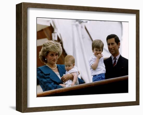 Prince Charles stands holding sons Prince William and Prince Harry with Princess Diana, Circa 1985-null-Framed Photographic Print