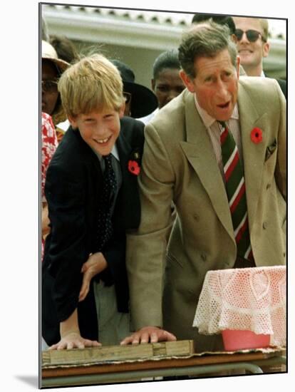 Prince Charles with Son Prince Harry Leaving Hand Prints in Concrete During Tour in South Africa-null-Mounted Photographic Print