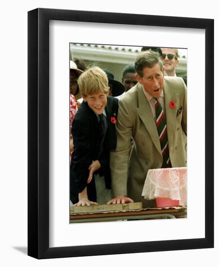 Prince Charles with Son Prince Harry Leaving Hand Prints in Concrete During Tour in South Africa-null-Framed Photographic Print