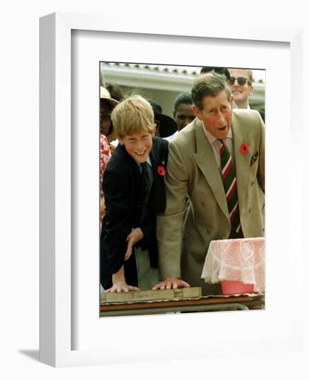 Prince Charles with Son Prince Harry Leaving Hand Prints in Concrete During Tour in South Africa-null-Framed Photographic Print