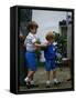 Prince Harry wearing a blue sweatshirt shorts and thomas the tank engine bag with Prince William on-null-Framed Stretched Canvas