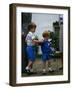 Prince Harry wearing a blue sweatshirt shorts and thomas the tank engine bag with Prince William on-null-Framed Photographic Print