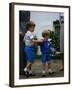 Prince Harry wearing a blue sweatshirt shorts and thomas the tank engine bag with Prince William on-null-Framed Photographic Print