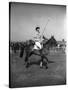 Prince Philips Rides Along on Horseback Holding Polo Stick During Game-null-Stretched Canvas