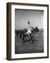 Prince Philips Rides Along on Horseback Holding Polo Stick During Game-null-Framed Photographic Print