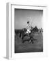 Prince Philips Rides Along on Horseback Holding Polo Stick During Game-null-Framed Photographic Print