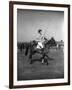 Prince Philips Rides Along on Horseback Holding Polo Stick During Game-null-Framed Photographic Print