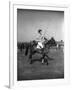 Prince Philips Rides Along on Horseback Holding Polo Stick During Game-null-Framed Photographic Print