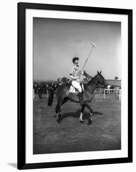 Prince Philips Rides Along on Horseback Holding Polo Stick During Game-null-Framed Photographic Print