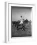 Prince Philips Rides Along on Horseback Holding Polo Stick During Game-null-Framed Photographic Print