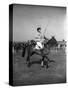 Prince Philips Rides Along on Horseback Holding Polo Stick During Game-null-Stretched Canvas